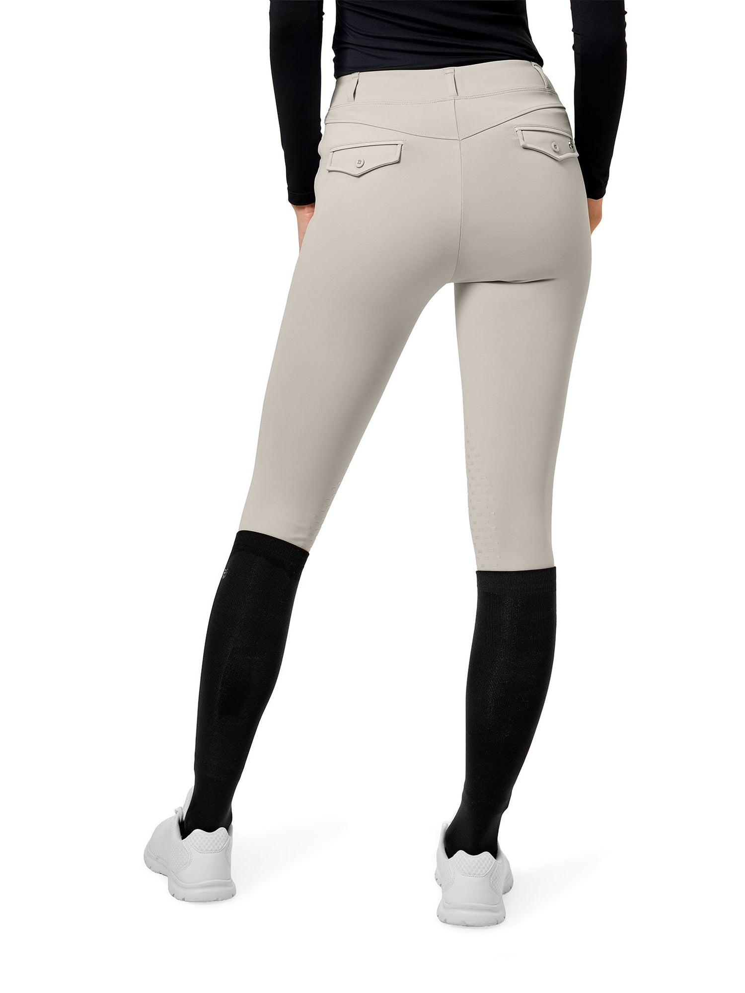 Immagine da studio di Equestrian Stockholm Collant da Equitazione Premium Greige da dietro, maglia e calzini neri e sneakers.
