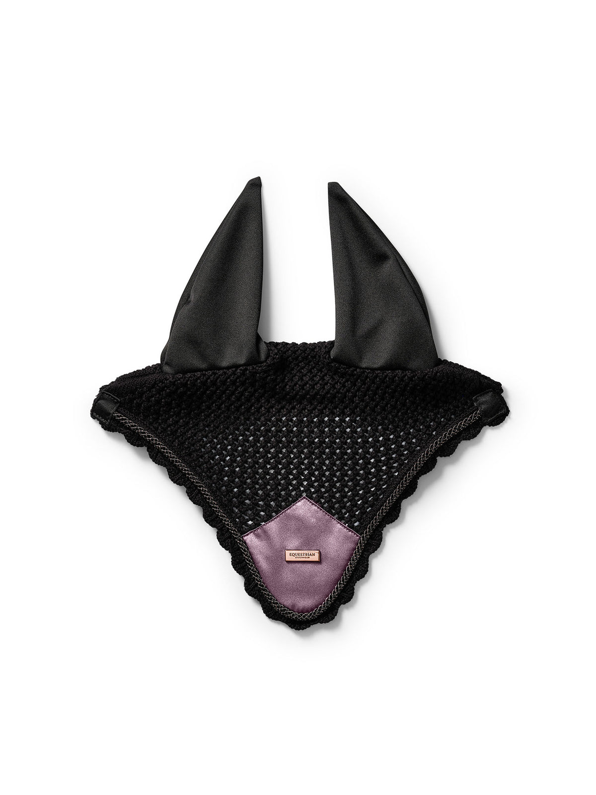 Studio image of Equestrian Stockholm Ear Bonnet Black Blush in black crochet with a pink satin patch and rose-gold badge.