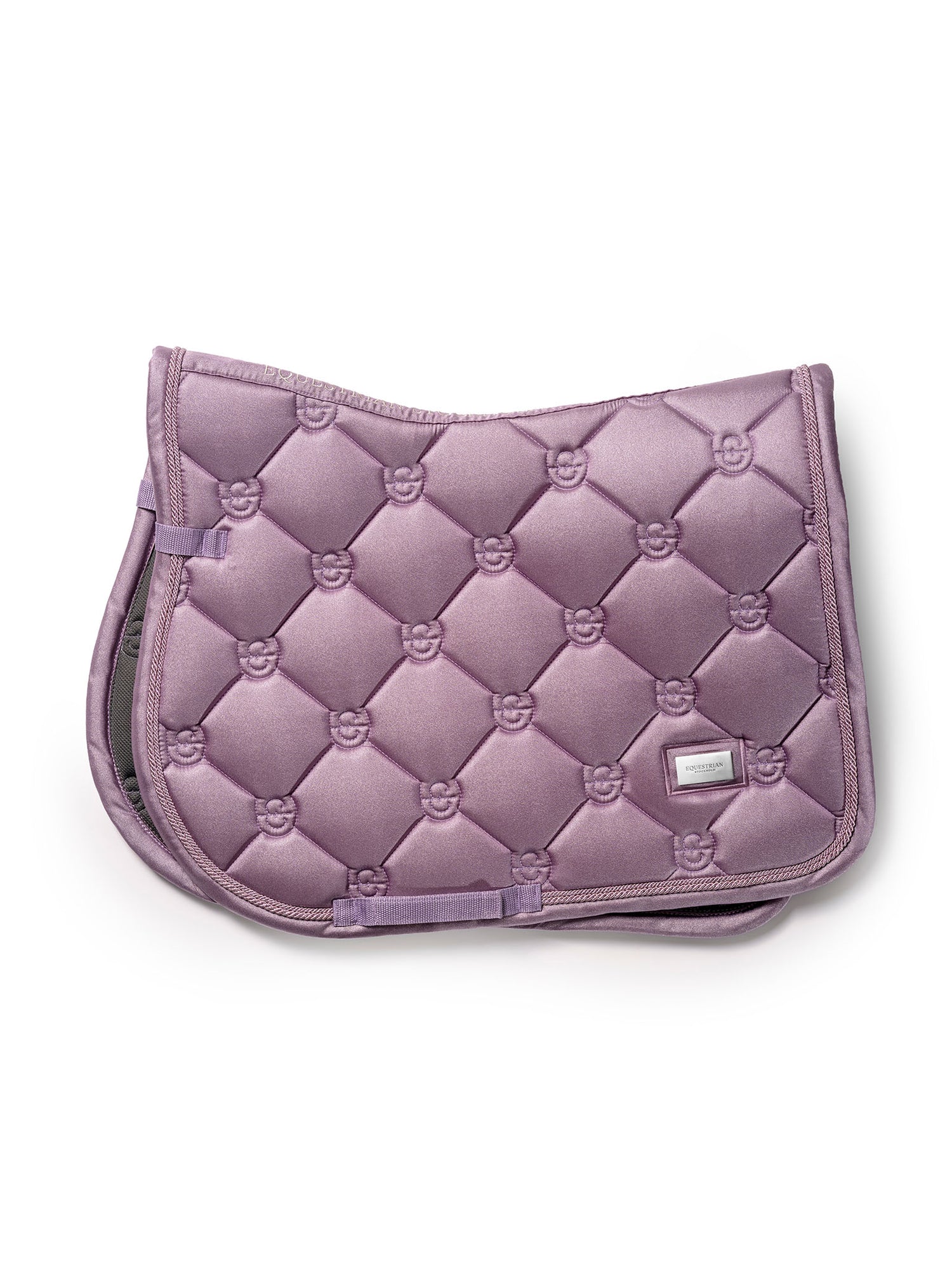 Studio image of Equestrian Stockholm Jump Saddle Pad Glow Dusty Purple with classic quilting and silver metal badge.