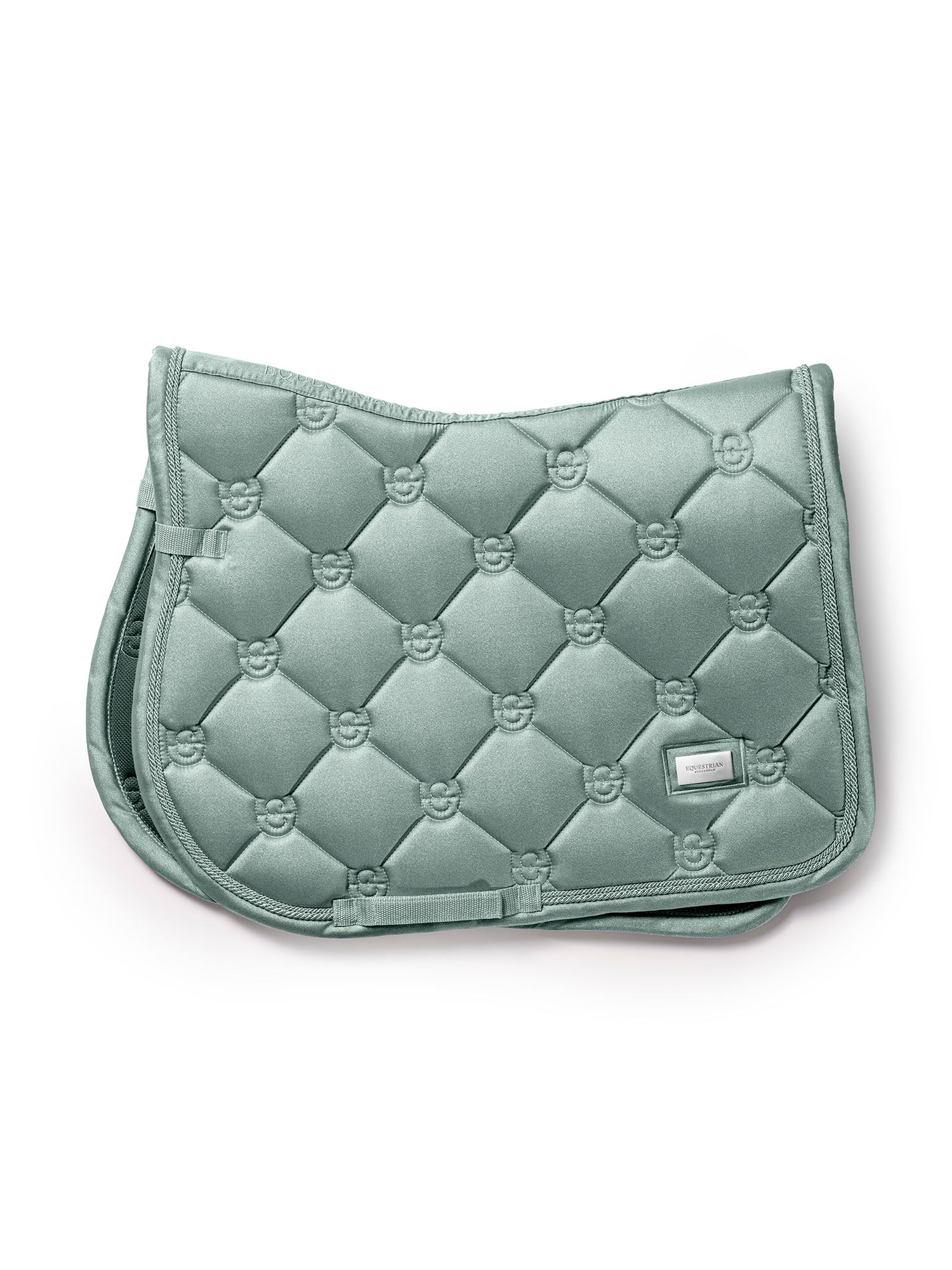 Studio image of Equestrian Stockholm Jump Saddle Pad Glow Mist Green featuring ES monogram quilting and silver badge.