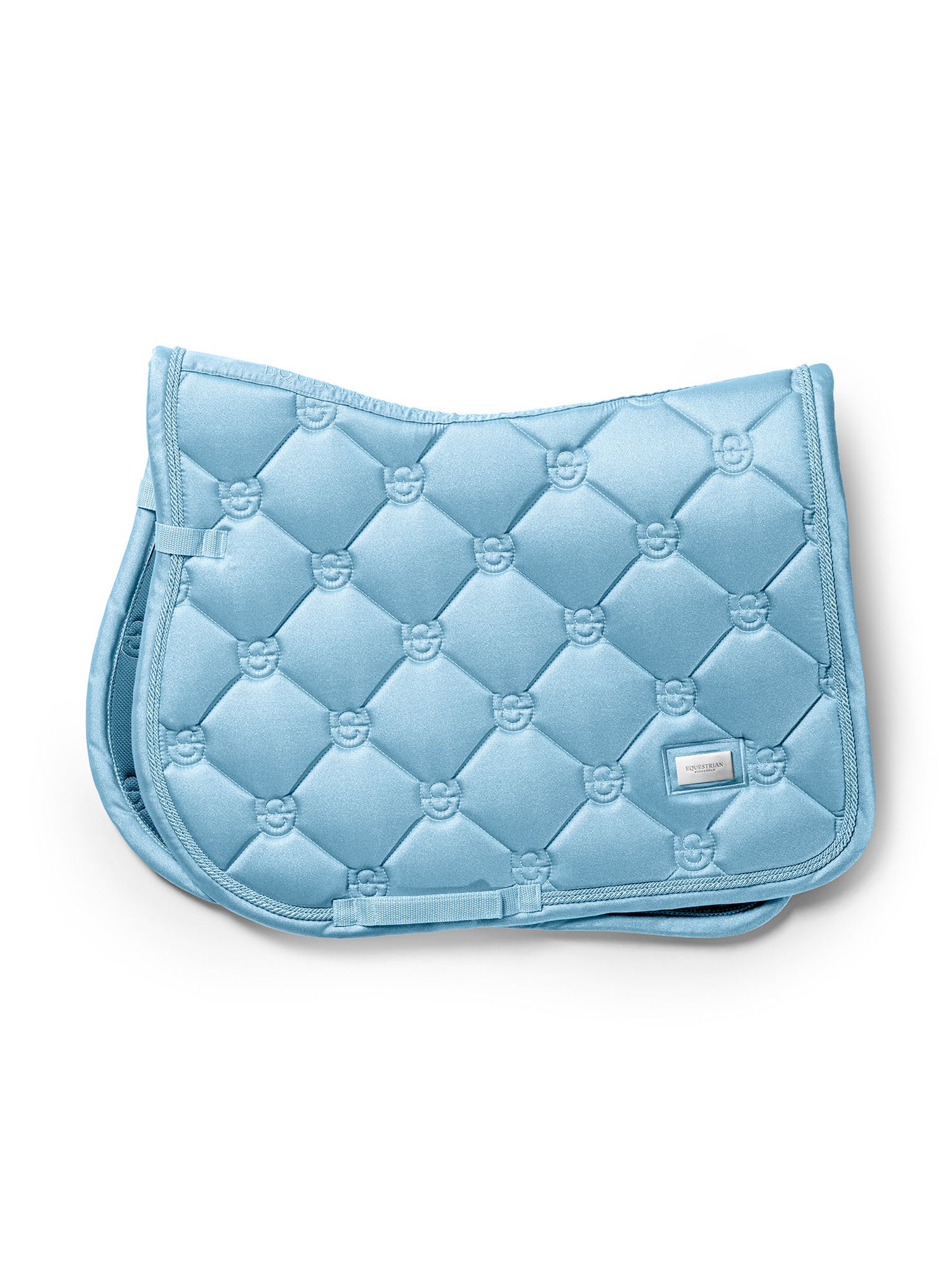 Studio image of Equestrian Stockholm Jump Saddle Pad Glow Soft Blue with classic quilting and silver metal badge.