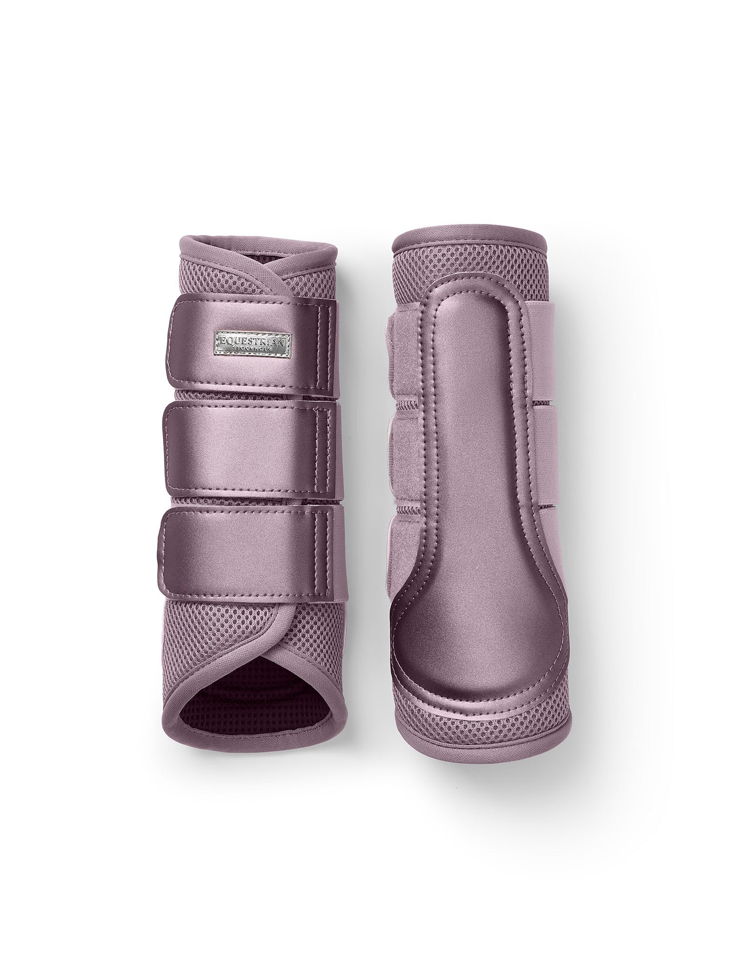 Studio image of Equestrian Stockholm Mesh Brushing Boots in Dusty Purple with breathable 3D mesh and a silver badge.