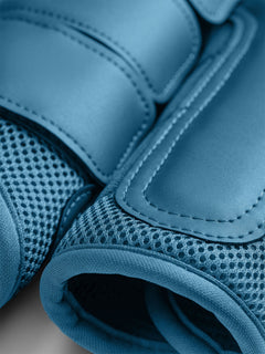 Studio image of Equestrian Stockholm Mesh Brushing Boots Aurora Blues with breathable blue 3D mesh and synthetic leather.