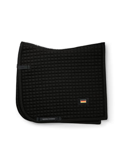 Studio image of Equestrian Stockholm Dressage Saddle Pad Cotton Black Germany with square quilting and flag badge.