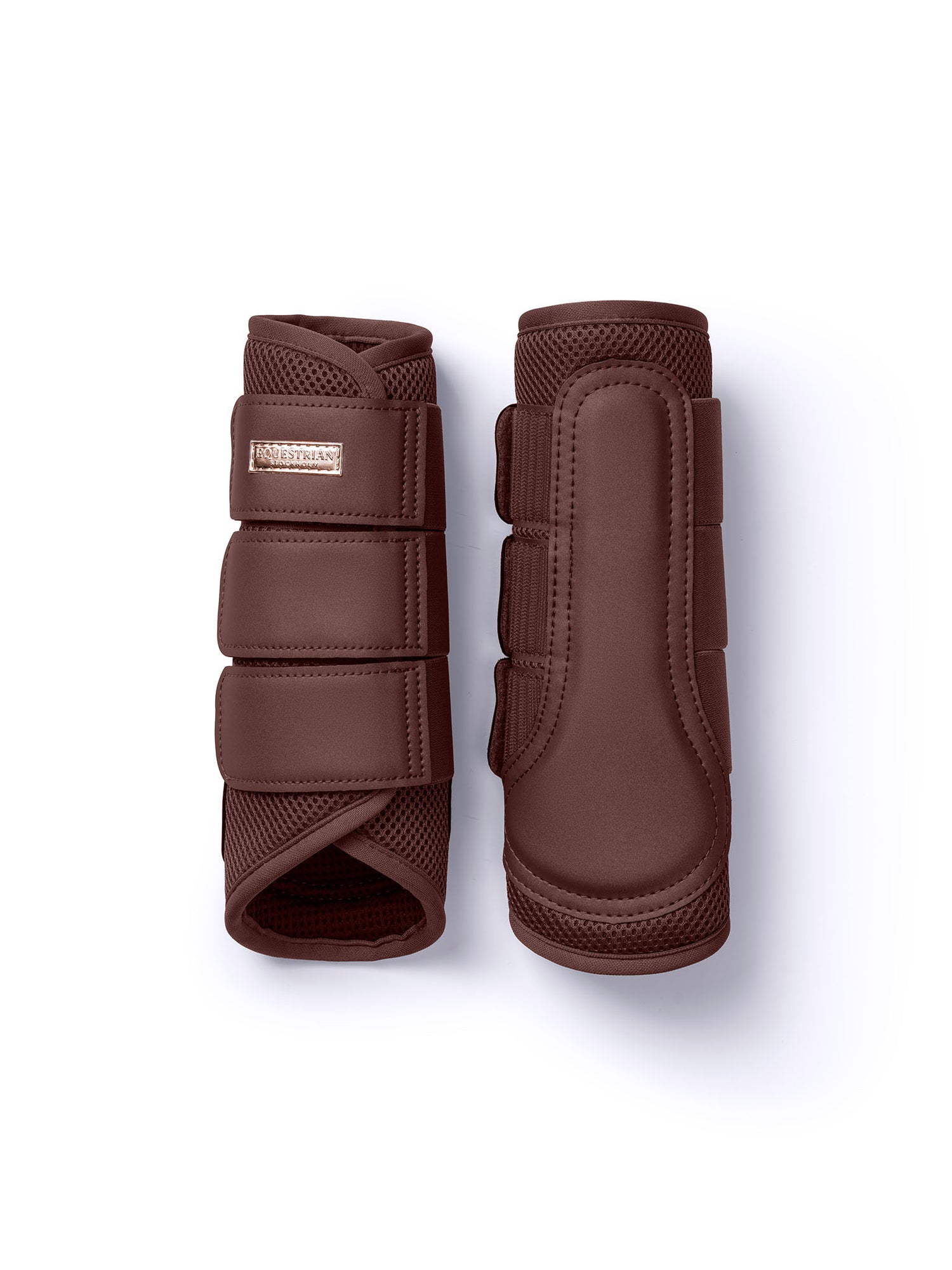 Studio image of Equestrian Stockholm Mesh Brushing Boots Endless Glow in brown with a rose-gold badge.