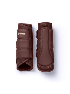 Studio image of Equestrian Stockholm Mesh Brushing Boots Endless Glow in brown with a rose-gold badge.