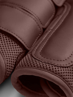 Studio image of brown Equestrian Stockholm Mesh Brushing Boots Endless Glow showing breathable mesh detail
