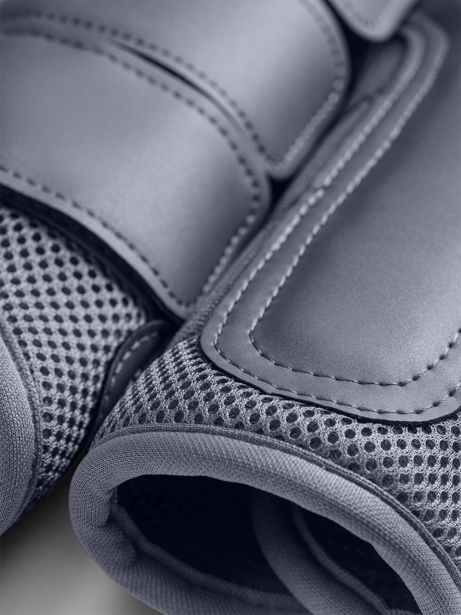 Studio image of Equestrian Stockholm Mesh Brushing Boots Metallic Blue detailing the 3D mesh and velcro straps.
