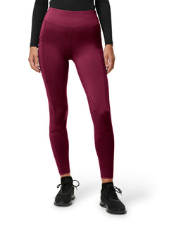 Studio image of Equestrian Stockholm Riding Tights Movement Merlot worn with a black top, socks, and sneakers.