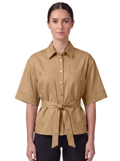 A model wearing the beige Equestrian Stockholm Shirt Safari Savannah Glow with short sleeves and a tie waist.