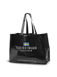 Studio image of Equestrian Stockholm Woven Stable Bag Sweden in black with the Swedish flag and logo.