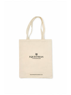 Studio image of Equestrian Stockholm beige cotton tote bag featuring a black logo and website print.
